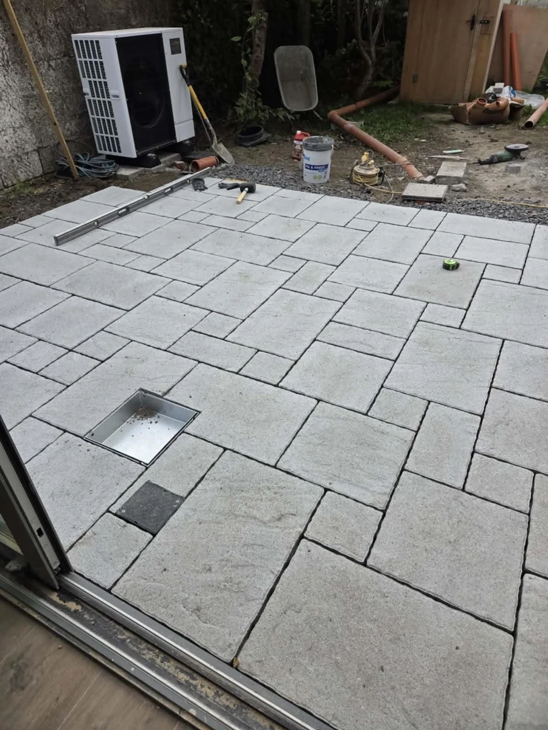 Paving installation with carefully laid stone slabs